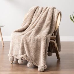 PAVILIA Taupe Sherpa Throw Blanket with Pom Poms - Lightweight Cozy Plush Blanket, Perfect for Couch or Sofa - Tan Fuzzy, 50x60