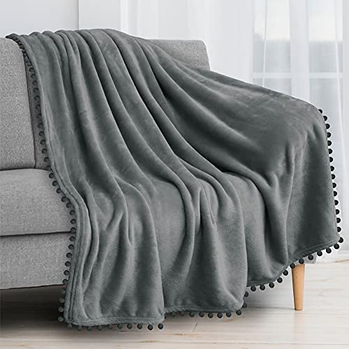 PAVILIA Fleece Throw Blanket for Couch with Pom Pom Fringe, Dark Grey, Soft Cozy Fuzzy Flannel Blanket for Sofa Bed, Lightweight Plush All Season Throw, 50x60 Inches