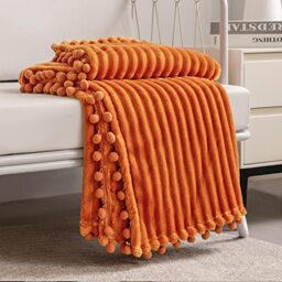 DISSA Fleece Blanket: Soft, Voluminous Fluffy Warm Cozy Perfect Throw for Couch Bed Sofa with Pom Poms Hem Flannel Blanket Throw Size 130 x 160 cm (51 x 63 inches) Orange