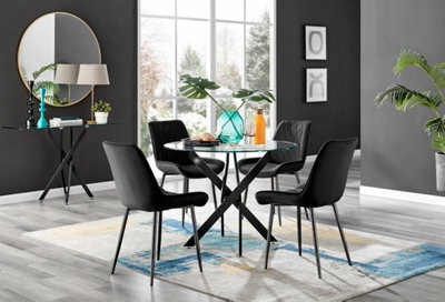 Furniturebox Novara Clear Tempered Glass 100Cm Round Dining Table With Black Starburst Legs & 4 Black Pesaro Soft Velvet Chairs - image 1
