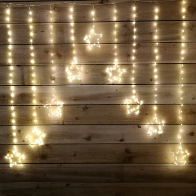 Samuel Alexander 1.2M X 1.2M Light Up Star Pin Wire Christmas Curtain Lights With 303 Warm White Leds - image 1