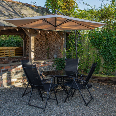 Samuel Alexander Outdoor 4 Person Round Glass Top Garden Dining Table Chairs With Beige Banana Parasol And Base - image 1