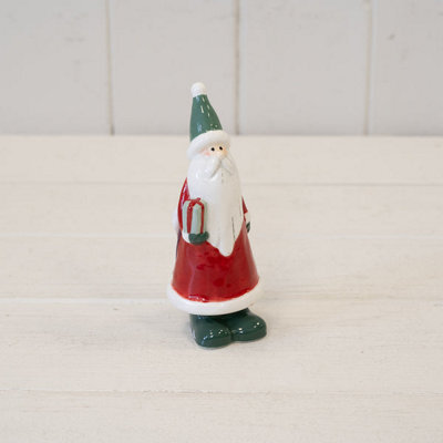 Ceramic Red Santa Holding A Present - image 1