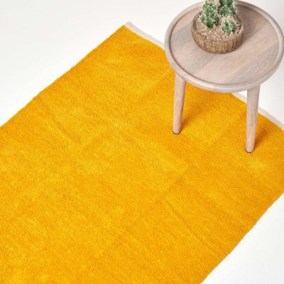 Homescapes Mustard 100% Cotton Plain Chenille Rug With Natural Trim, 45 X 70 Cm - image 1