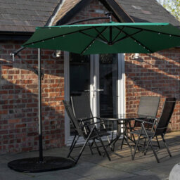 Samuel Alexander Outdoor 4 Person Round Glass Top Garden Dining Table Chairs With Green Banana Lit Parasol And Base Set - thumbnail 1