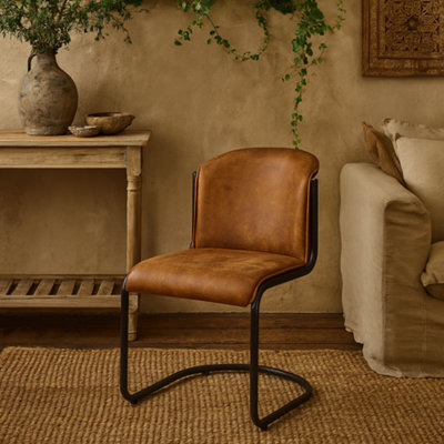 Wyld Haus Germain Arched Tan Faux Leather Dining Chair With Black Cantilever Frame - image 1