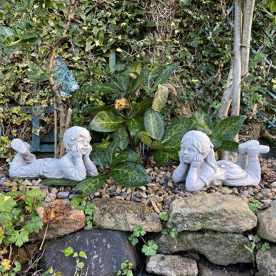 Cheerful Laying Boy And Girl Outdoor Ornament - image 1