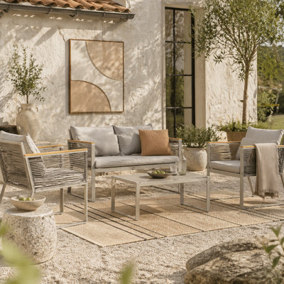 Wyld Haus Rotoyo Kaha Grey 4-Seater Rattan-Style Outdoor Sofa Set With Cushions And Tempered Glass Coffee Table - image 1