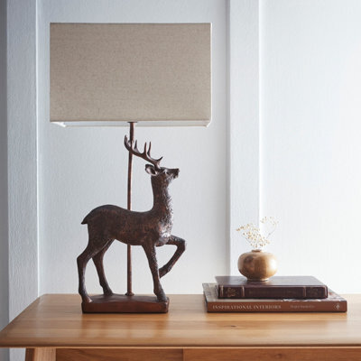 K Living Stag Table Lamp In An Antique Copper Resin Table Lamp With A Natural Linen Lampshade - image 1