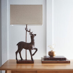 K Living Stag Table Lamp In An Antique Copper Resin Table Lamp With A Natural Linen Lampshade