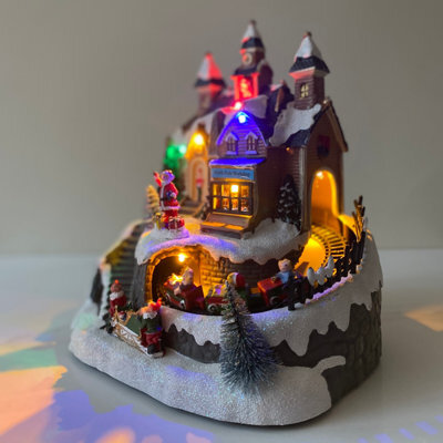 Garden Selections Santa Christmas Scene Ornament With Lights Moving Train And Sound - image 1