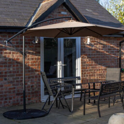 Samuel Alexander Outdoor 6 Person Rectangular Glass Top Garden Dining Table Benches & Chairs With Beige Banana Parasol And Base - thumbnail 1