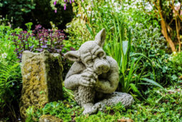Solid Cast Stone Dog Gargoyle In Sleepy Pose - thumbnail 4