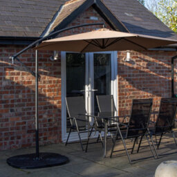 Samuel Alexander Outdoor 4 Person Rectangular Glass Top Garden Dining Table Chairs With Beige Banana Parasol And Base