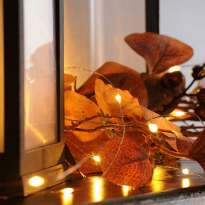 Festive Lights 2M 20 Amber Led Battery Powered Decorative Micro Firely Fairy String Lights On Silver Wire - image 1