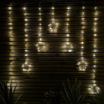 Samuel Alexander 1.2M Battery Operated Star Christmas Curtain Lights With 140 Warm White Leds - image 1