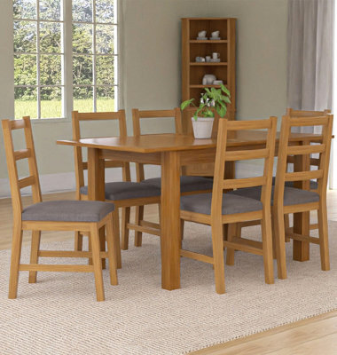 Hallowood Furniture Camberley Oak Butterfly Extending Dining Table With 6 Ladder Back Chairs In Light Grey Fabric Seats - image 1