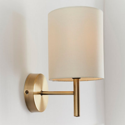 Anson Lighting Phoenix Wall Light Finished In Antique Brass Plate And Cream Fabric - image 1