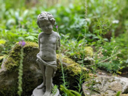 Oakley Charming Stone Cast Vine Boy Statue - thumbnail 5