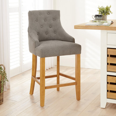 The Furniture Market Luxury Grey Woven Fabric Scoop Back Kitchen Counter Bar Stool Quilted Button Back Stud Detailing Solid Wood Frame