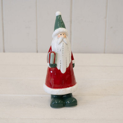 Ceramic Red Santa Holding A Present - image 1