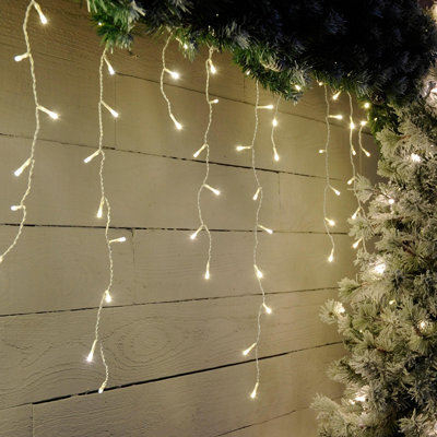 Festive 17.8M Indoor & Outdoor Snowing Effect Icicle Christmas Lights 720 Warm White Leds - image 1