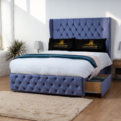 UKBEDFURNITURE Luxor Blue Plush Wingback Divan Bed 2 Foot End Drawers With 10 Inch Orthopaedic Mattress & 54 Inch Headboard - image 1