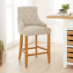The Furniture Market Luxury Natural Oatmeal Fabric Scoop Back Kitchen Counter Bar Stool Quilted Button Back Stud Detailing Solid Wood Frame