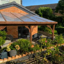 Rutland County Garden Furniture Wall Mounted Polycarbonate Roof Gazebo - Rustic Brown - 3M Depth X 4.34M Width - 3 Posts / Brown Glazing Bars / Opal Sheets - thumbnail 4