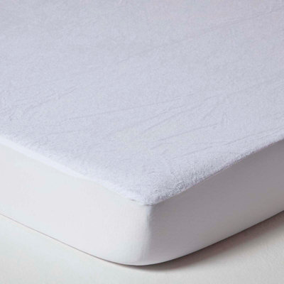 Homescapes Cot Bed Terry Towelling Waterproof Mattress Protector 70 X 140 Cm, Pack Of 2 - image 1
