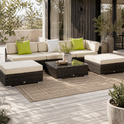 Wyld Haus Baka Brown 9-Seater Modular Rattan Outdoor Sofa And Tempered Glass Coffee Table Set With Cream Cushions - image 1