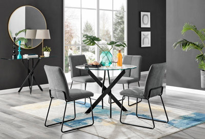 Furniturebox Novara Clear Tempered Glass 100Cm Round Dining Table With Black Starburst Legs & 4 Dark Grey Halle Soft Fabric Chairs - image 1