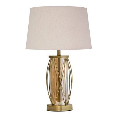 Lighting Supermarket Ashleigh Antique Brass Amber Glass Cylinder Lantern Table Lamp With Natural Linen Shade - image 1