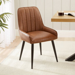 The Furniture Market Cooper Vintage Tan Brown Faux Leather Dining Chair Flute Back Design Black Satin Metal Legs Cushioned Seat Adjustable Feet