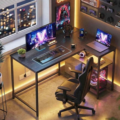 Corner Gaming Desk With Power Outlets, L-Shaped Computer Desk, Reversible Storage Shelves, Ebony Black - image 1