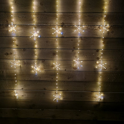 Samuel Alexander 1.2M X 1.3M Light Up Twinkling Snowflake Christmas Curtain Light With Warm White Leds - image 1