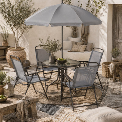 Wyld Haus Misotte 6-Piece Outdoor Dining Set, Grey And Coffee - 4 Folding Mesh Chairs, Round Tempered Glass Table And Parasol - image 1