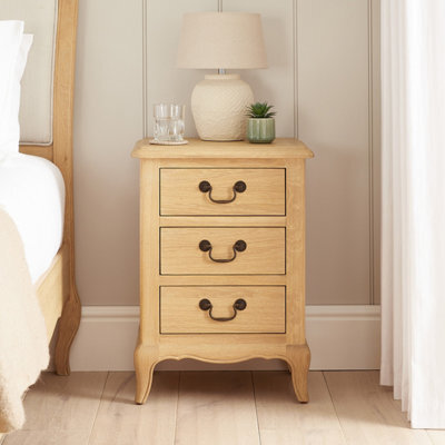 The Furniture Market French Chateau Oak Bedside Table 3 Drawer Solid Nightstand Cabriole Legs Antique Bronze Handles Natural Whitewash Finish - image 1