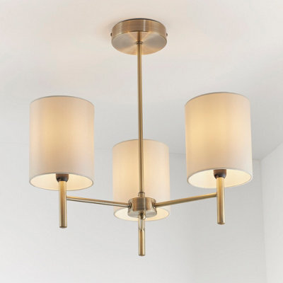 Anson Lighting Phoenix 3Lt Semi Flush Light Finished In Antique Brass Plate And Cream Fabric - image 1