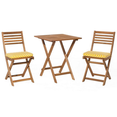 Beliani Bistro Set With Cushions Fiji Acacia Wood Yellow - image 1