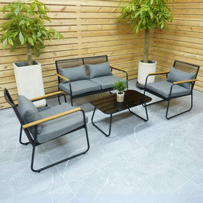 Home Source Cove Black Metal 4 Piece Outdoor Garden Table And Chair Set Padded Cushion Glass Tabletop - image 1