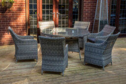 Sh&g Tintagel 6 Seat Dining Table Set - 7 Piece Round Table & Chairs - Aluminium & Grey Rattan With Dark Grey Cushions - Outdoor