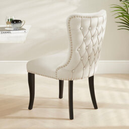 The Furniture Market Boudoir Natural Oatmeal Fabric Wing Back Dining Chair Deep Button Back Chrome Stud Detailing Black Satin Legs Sprung Base