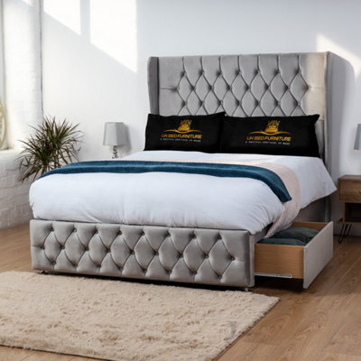 UKBEDFURNITURE Luxor Grey Plush Wingback Divan Bed 2 Foot End Drawers With 10 Inch Orthopaedic Mattress & 54 Inch Headboard - image 1