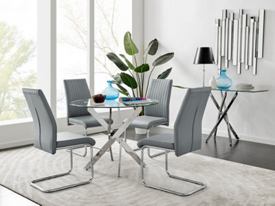 Furniturebox Novara Clear Tempered Glass 100Cm Round Dining Table With Chrome Starburst Legs & 4 Grey Lorenzo Faux Leather Chairs - image 1