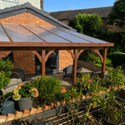 Rutland County Garden Furniture Wall Mounted Polycarbonate Roof Gazebo - Rustic Brown - 4.5M Depth X 7.22M Width - 4 Posts / Brown Glazing Bars / Opal Sheets - thumbnail 4