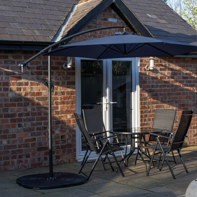 Samuel Alexander Outdoor 4 Person Round Glass Top Garden Dining Table Chairs With Blue Banana Parasol And Base Set - image 1