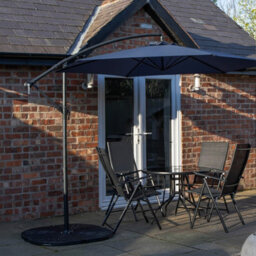 Samuel Alexander Outdoor 4 Person Round Glass Top Garden Dining Table Chairs With Blue Banana Parasol And Base Set