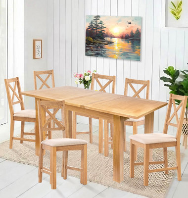 Hallowood Furniture Camberley Oak Butterfly Extending Dining Table With 6 Cross Back Chairs In Beige Fabric Seats - image 1