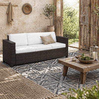 Wyld Haus Sediri Brown 3-Seater Rattan Outdoor Sofa With Cream Cushions, Galvanised Metal Frame - image 1